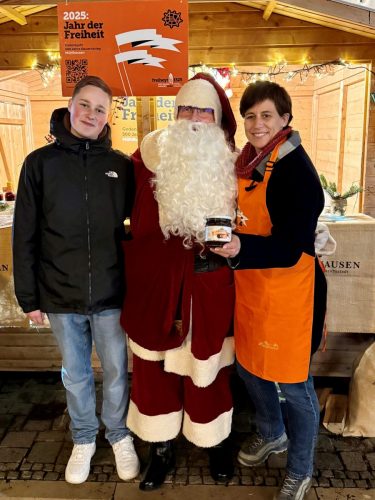 Weihnachtsmann beim Musverkauf